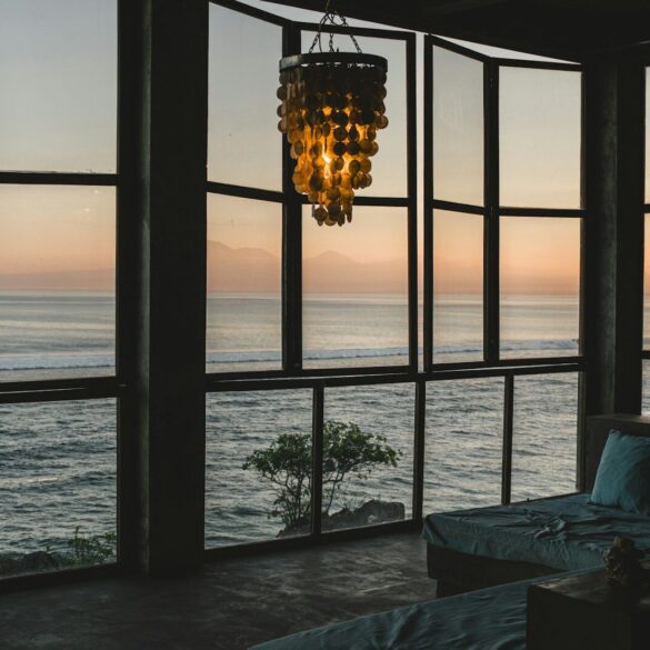 Modern room with ocean view at sunset