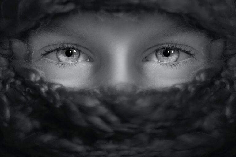grayscale shot of person's eyes