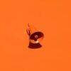 orange megaphone on orange wall