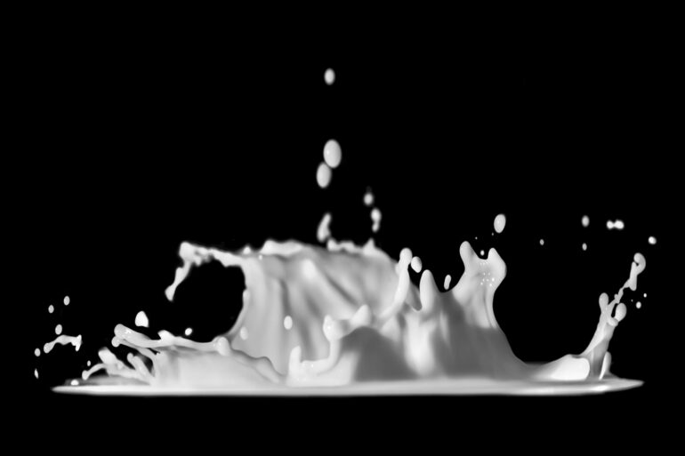 a black and white photo of a liquid splash