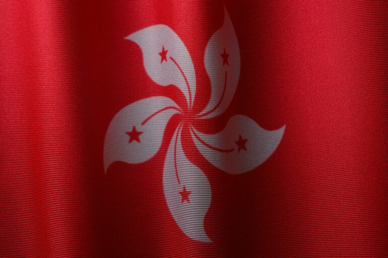 a close up of a red and white flag