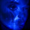 womans face with blue light