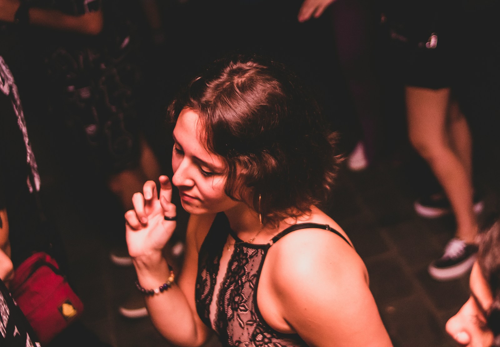 a woman talking on a cell phone in a crowd